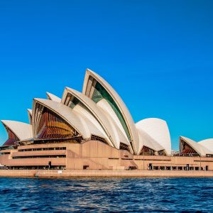 The Sydney Opera House near the beautiful sea under the clear blue sky